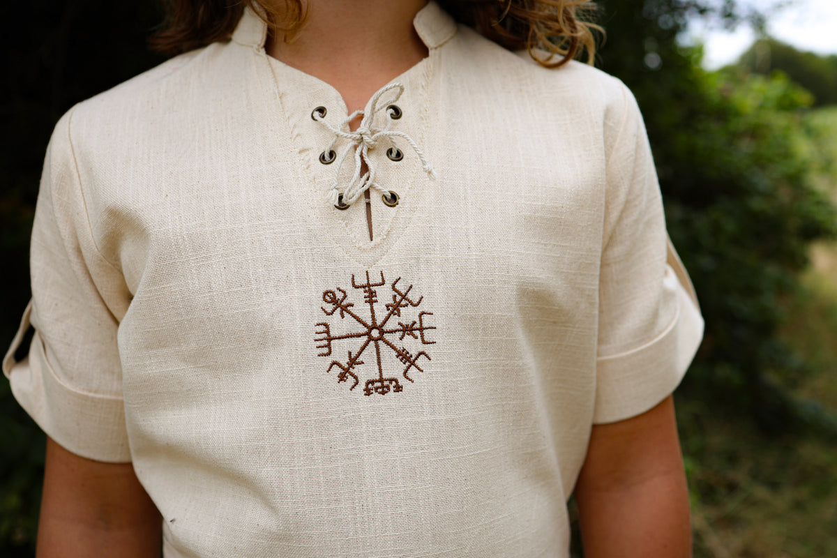 Close-up of Boys Vegvisir Celtic Shirt showing embroidered Vegvisir symbol, lace-up neck and natural cotton slub fabric