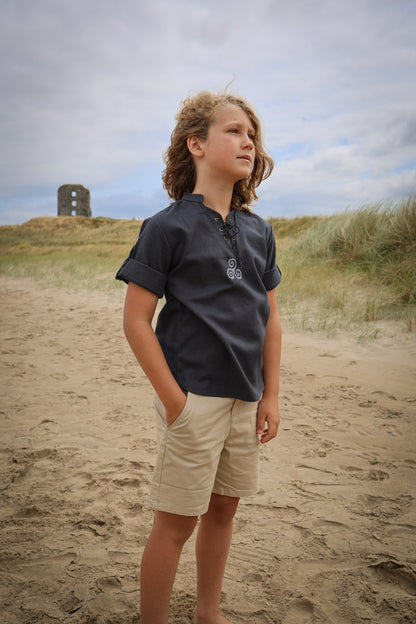 Boys navy Celtic Medieval Shirt with Triskele embroidery, lace-up neckline and roll-up short sleeves.