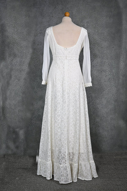 Annagh cotton lace wedding dress on mannequin with low V back, lace sleeves and softly flared skirt