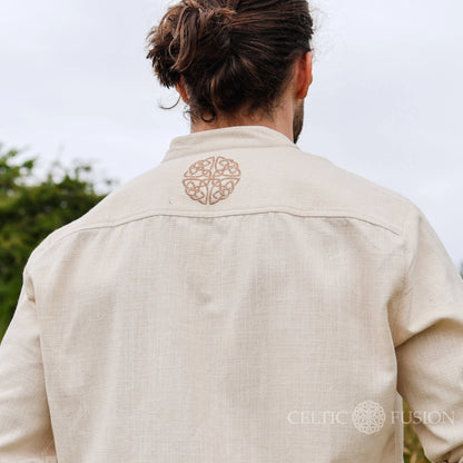 Back view of the Celtic Shield Collarless Shirt in beige, showing embroidered Celtic shield symbol on Irish Celtic Clothing designed by Celtic Fusion