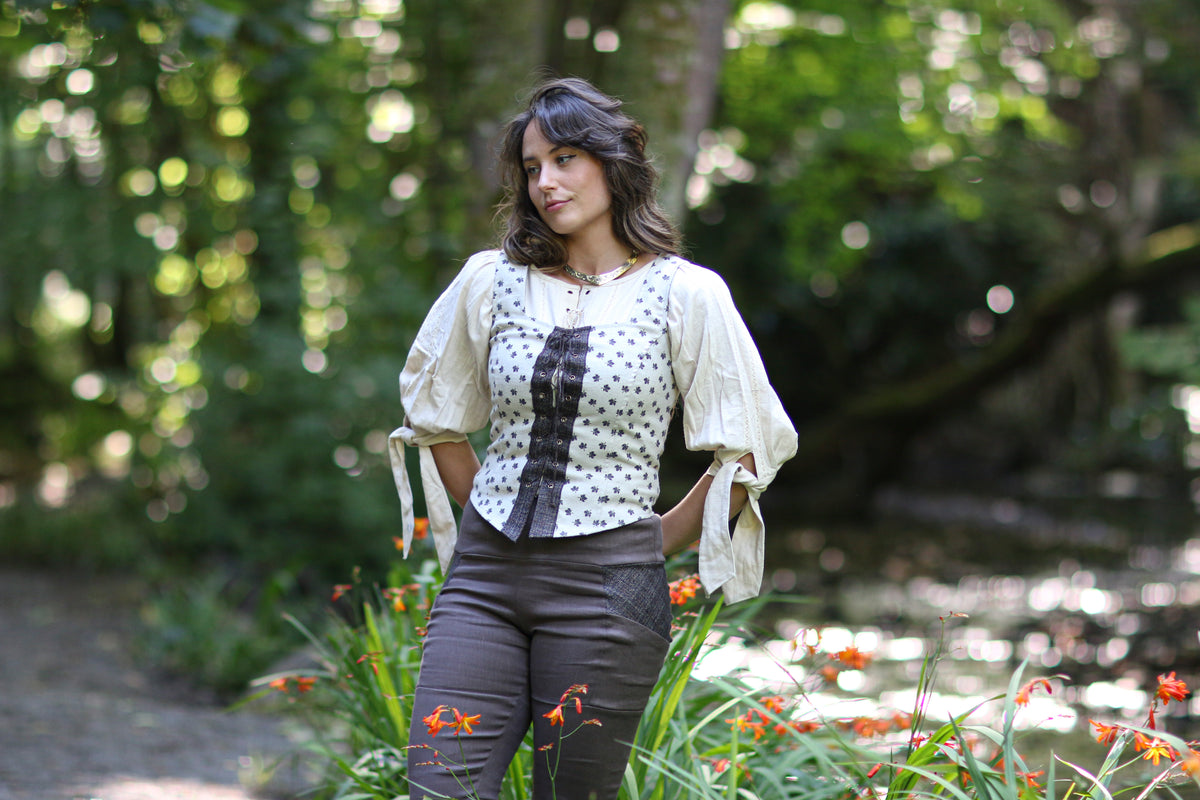Cream leaf print layering corset top styled with a long blouse for a folklore-inspired outfit.