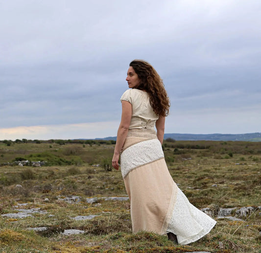 Back view of Banda sustainable skirt design showing natural cotton jute panels, lace patchwork and flowing earthy maxi silhouette