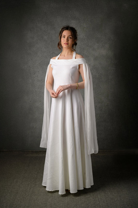 Celtic Fusion Ethereal linen wedding dress with off shoulder neckline, flowing draped sleeves and full-length bridal skirt