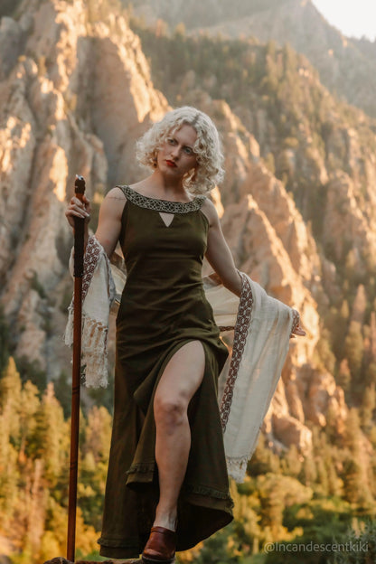 Celtic embroidered neckline dress in forest green, close-up showing knotwork detail and soft V opening at the front
