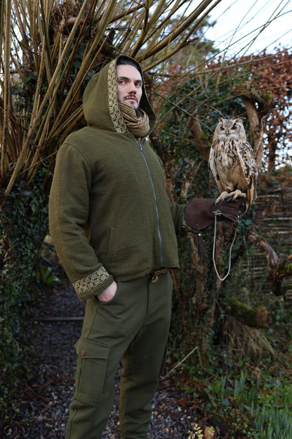 Green Hooded Celtic Jacket featuring a hood, golden Celtic knot embroidery on the cuffs and hood trim, and a front zip Made in handwoven cotton with soft fleece lining for warmth with owl purched an mans hand