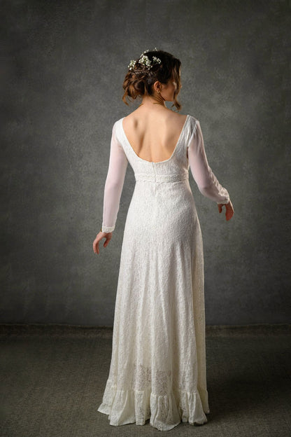 Back view of Annagh low back wedding dress with sleeves in ivory cotton lace and soft flowing silhouette