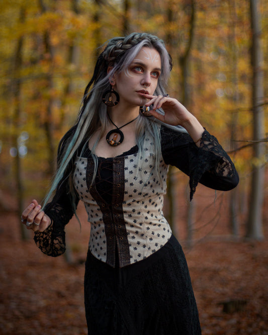 Maple Leaf Corset Top with dark leaf print, front lace-up fastening and fitted panelled waist.