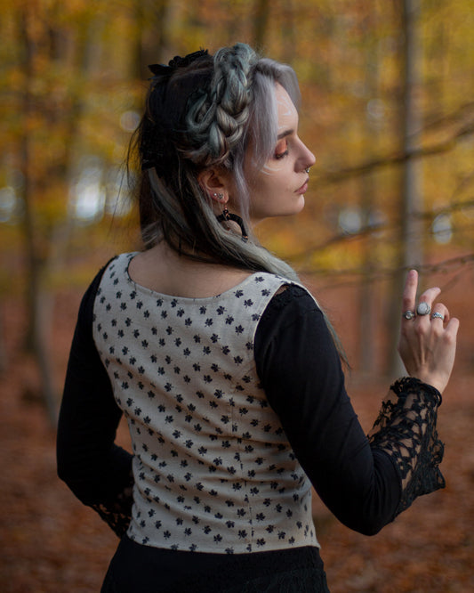 Maple Leaf lace-up bodice showing the fitted back, sleeveless shape and cream leaf print fabric.