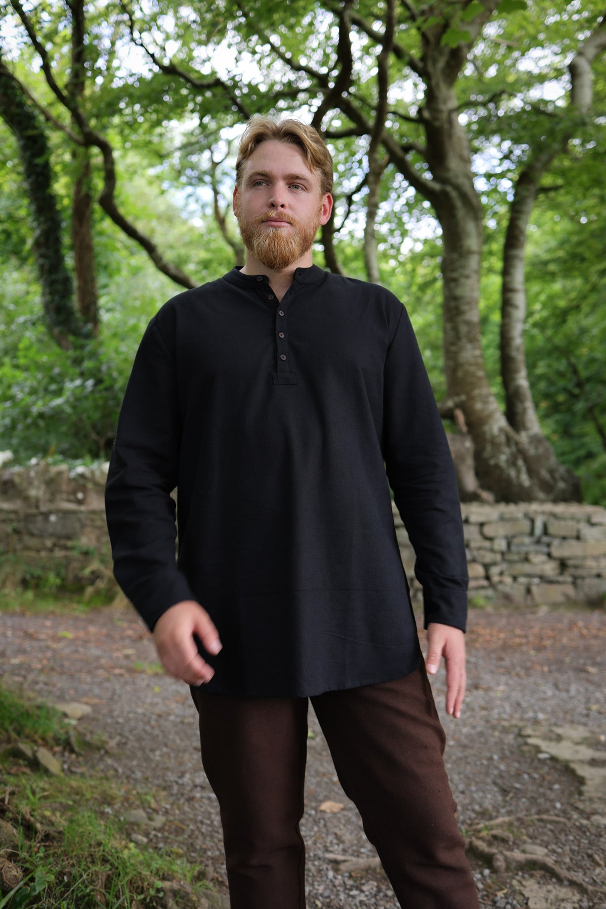 Men’s black cotton grandfather shirt with relaxed longline loose fit, collarless neckline and embroidered cuff detailing.
