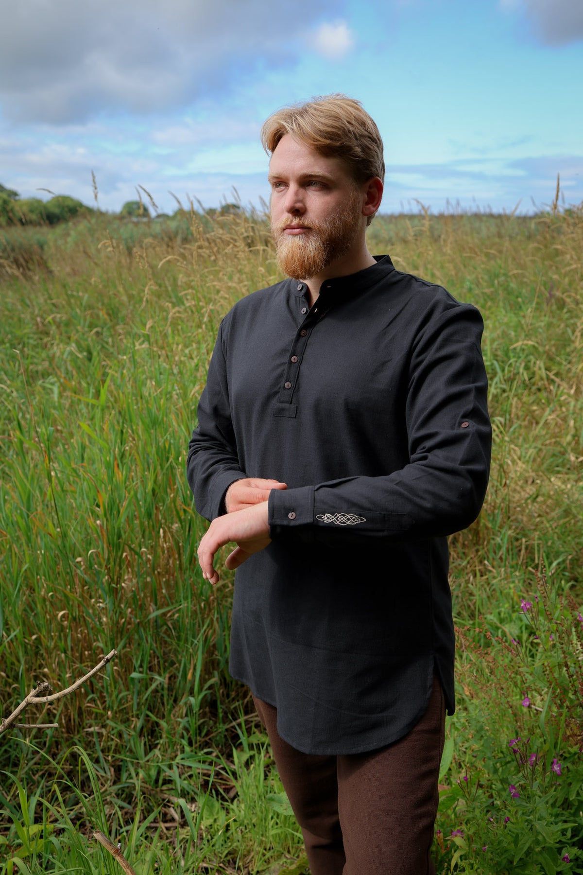 Men’s black grandfather collar shirt with long sleeves, textured heavy cotton and subtle Celtic embroidery at the cuffs