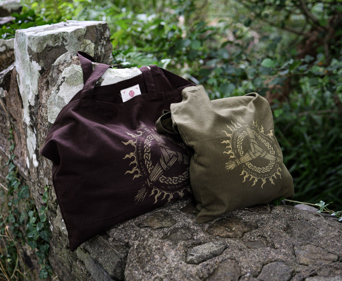 Upcycled brown and olive green Irish folklore tote with Brigid-inspired Celtic knotwork and printed verse design.