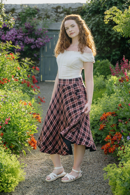 Vintage Style Plaid Midi Skirt in soft pink and brown cotton check, styled with an off-white off-shoulder corset top in a summer flower garden.
