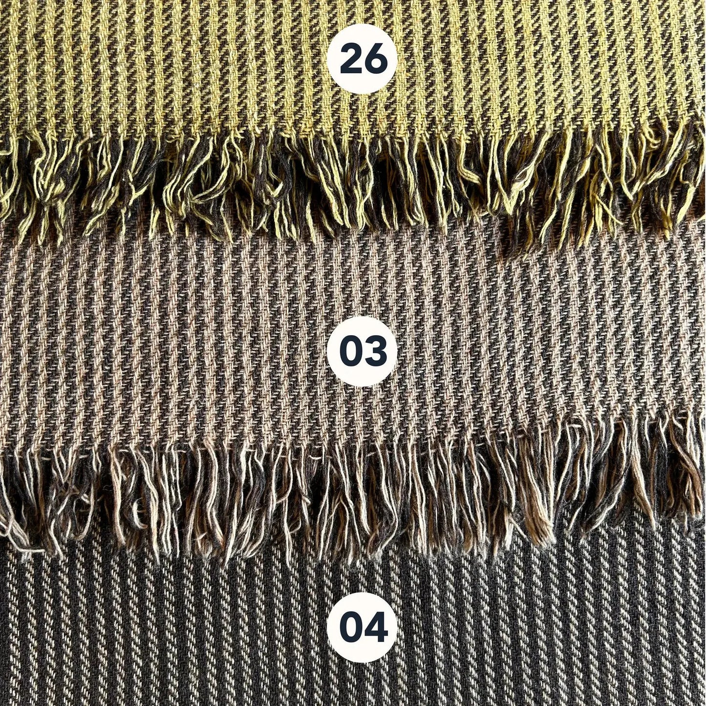 Wool blend shawl colour options with handwoven striped texture and fringe edge in earthy folklore tones