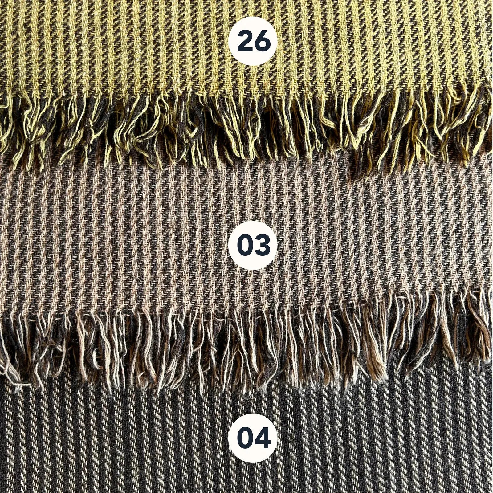 Wool blend shawl colour options with handwoven striped texture and fringe edge in earthy folklore tones
