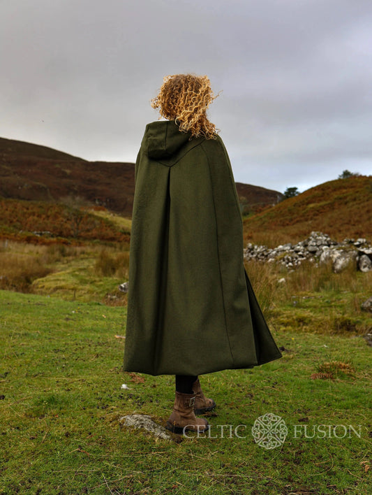 Back view of long green hooded wool cloak showing full-length flowing silhouette and oversized hood