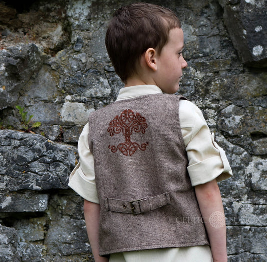 Back view of boys Celtic tweed waistcoat showing Tree of Life embroidery and adjustable back strap