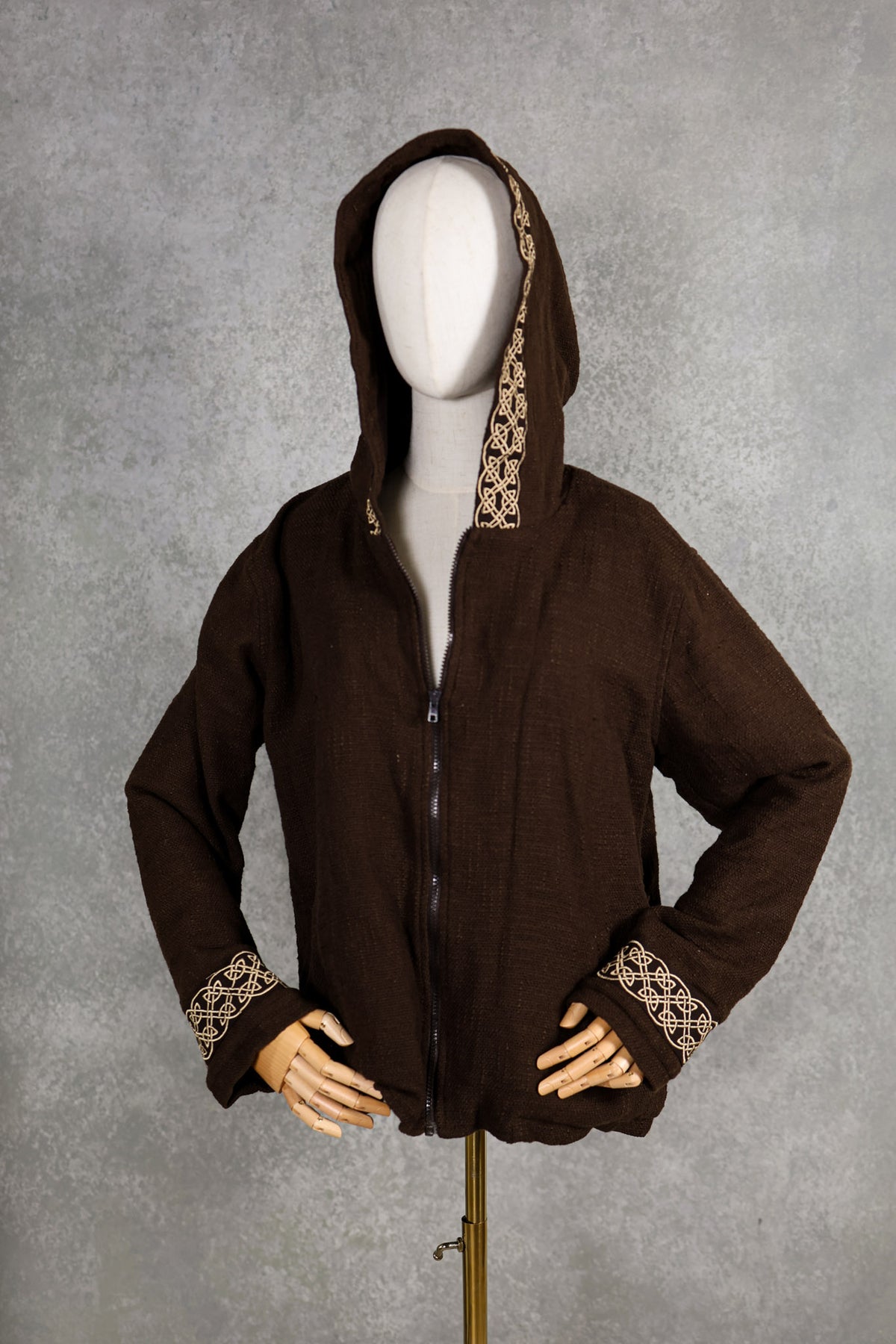 new edition brown hooded short jacket with fleece lining, spacious pockets and celtic knot embroidery along the hood and cuffs