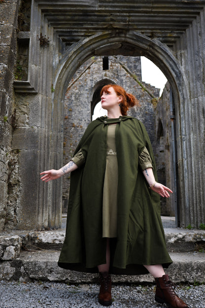 green felt wool maxi cape with generous hood, open sides and relaxed folklore-inspired drape by celtic fusion design.