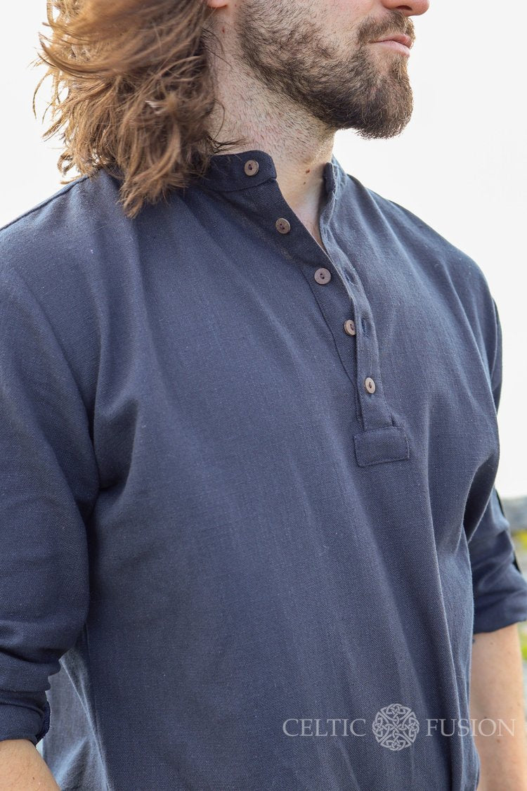Close-up of navy blue men’s grandad collar shirt with wooden buttons and collarless neckline