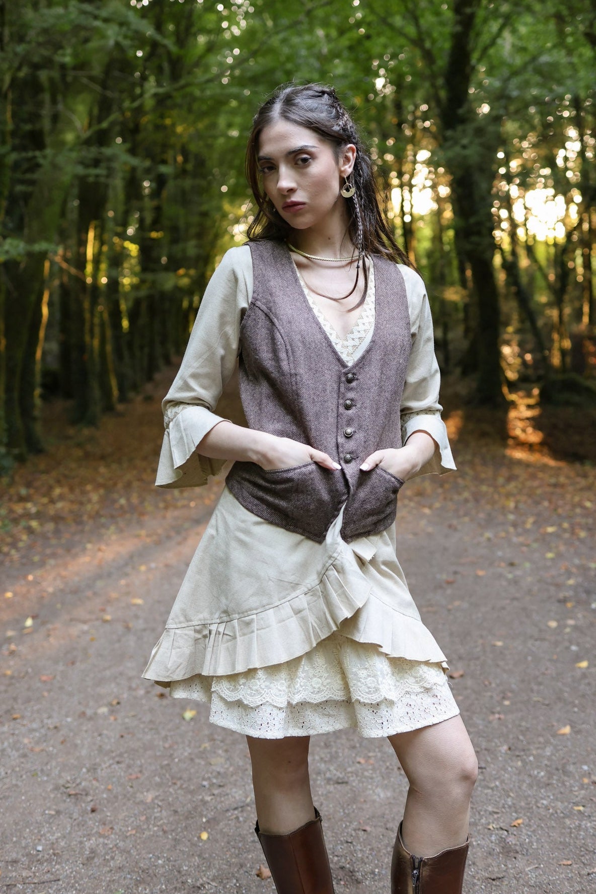 Close-up of earthy brown tweed waistcoat with tailored front, buttons and welt pockets