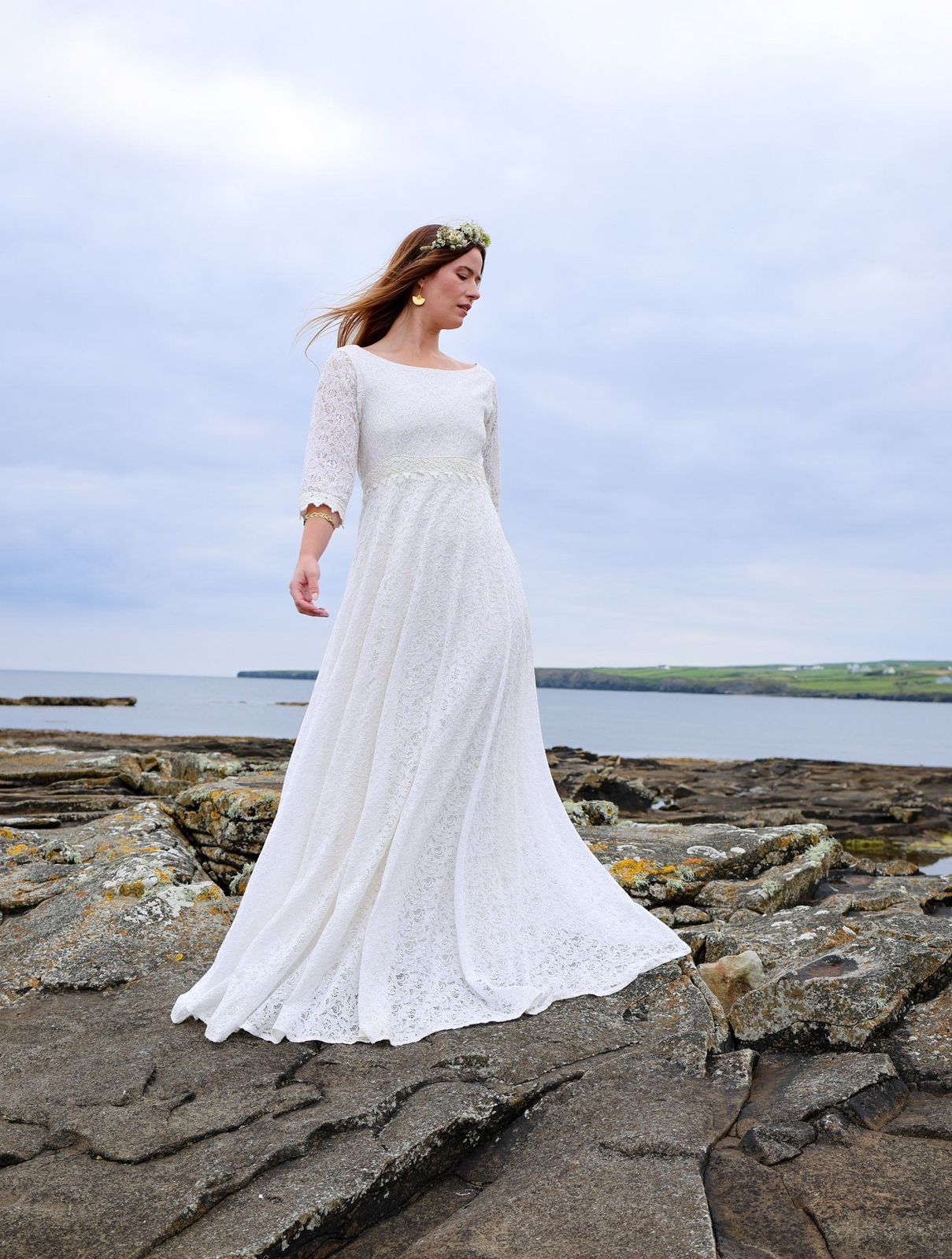 Irish Designer full-length ivory wedding dress in floral lace with elegant three quarter sleeves and soft A-line shape
