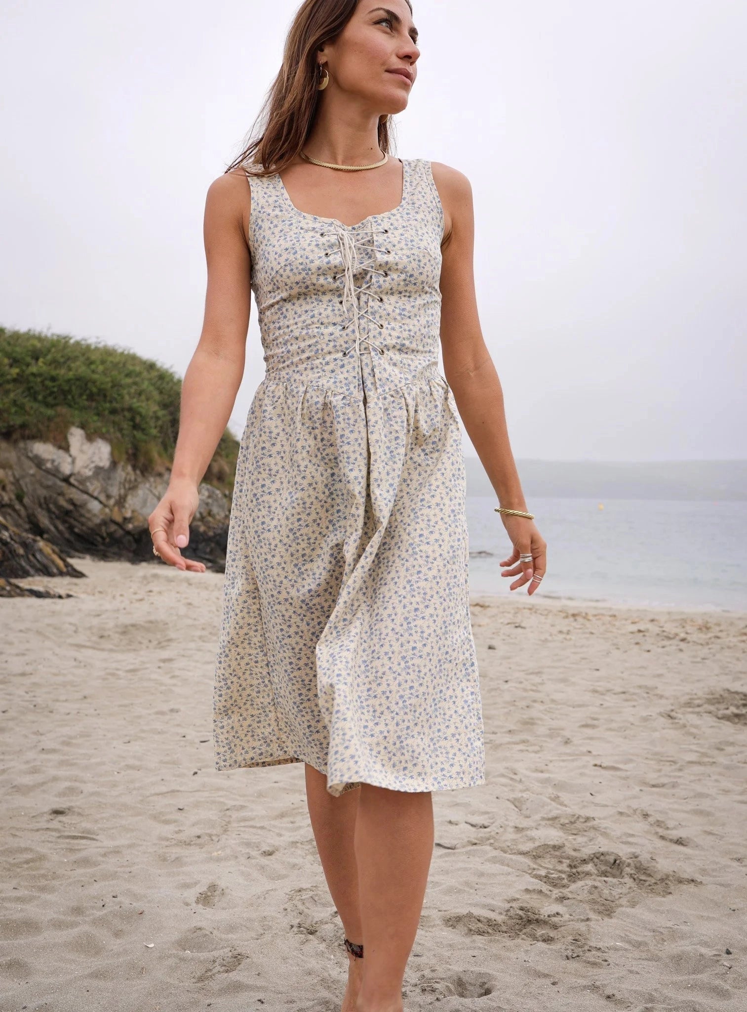 Front view of Iris floral linen dress with corset front detail and pockets, styled as a linen blend A-line midi dress designed by Celtic Fusion