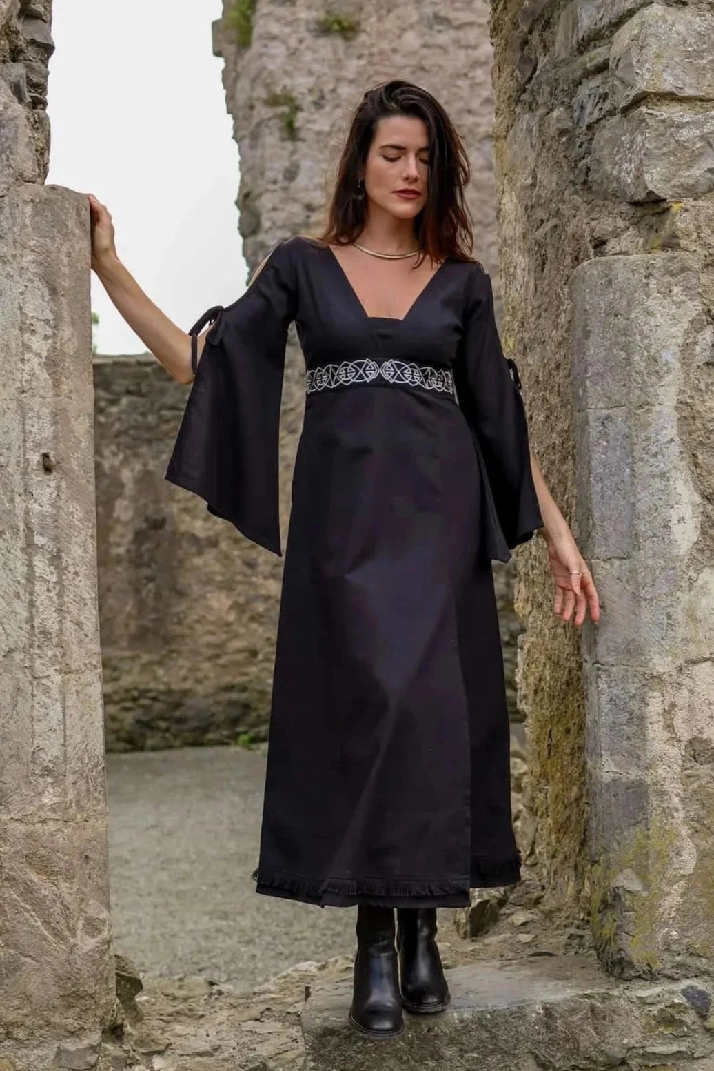 Maeve Black Celtic Dress, black folklore dress with split bell sleeves, front slit and full length skirt