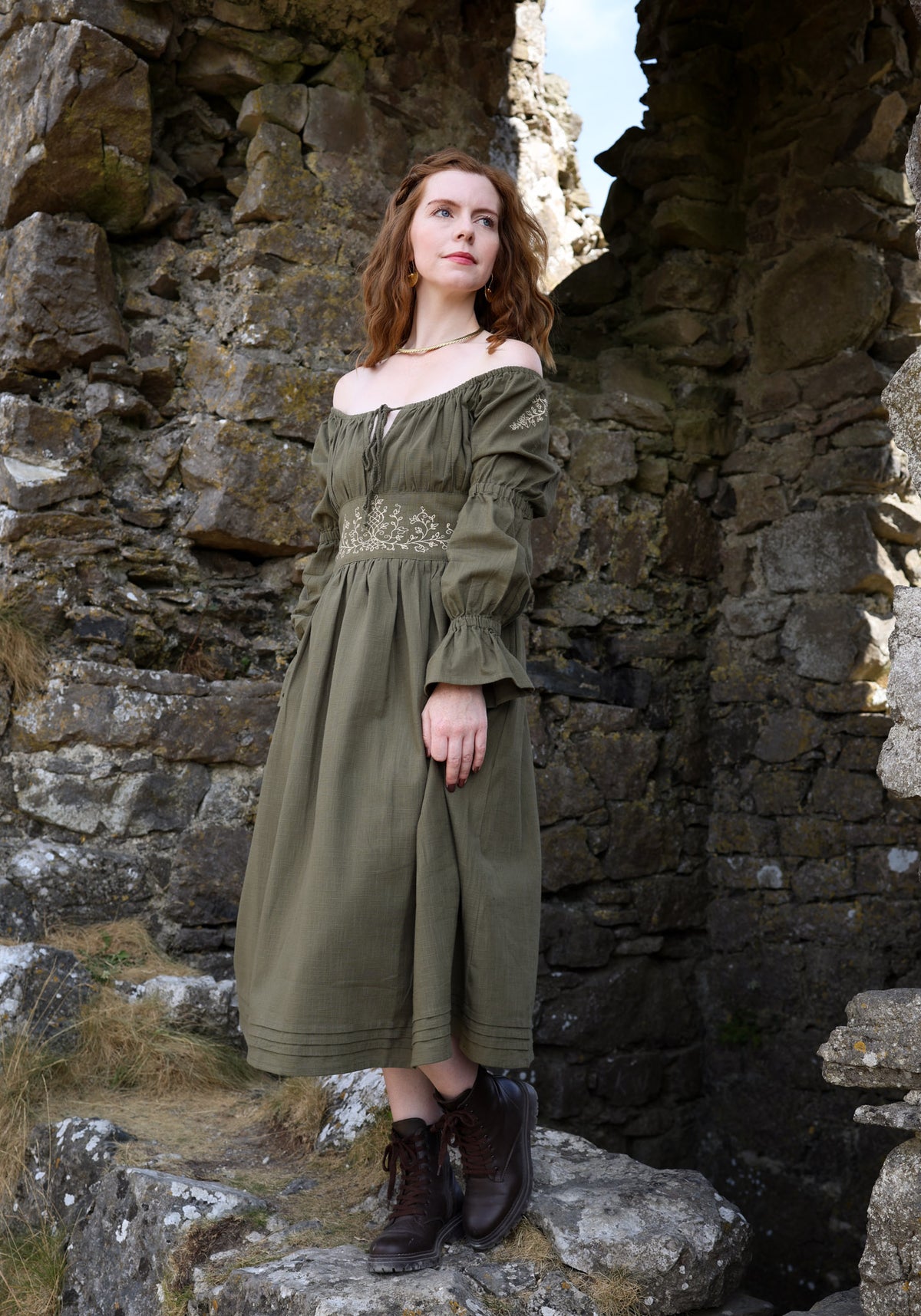 Sage green off shoulder embroidered dress with corset back, botanical waist detail and flowing cotton midi skirt designed by Celtic Fusion clothing.