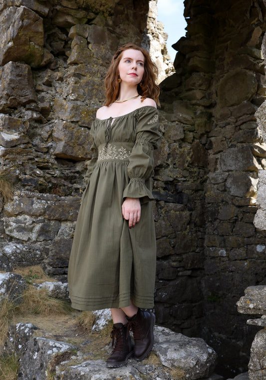 Sage green off shoulder embroidered dress with corset back, botanical waist detail and flowing cotton midi skirt designed by Celtic Fusion clothing.