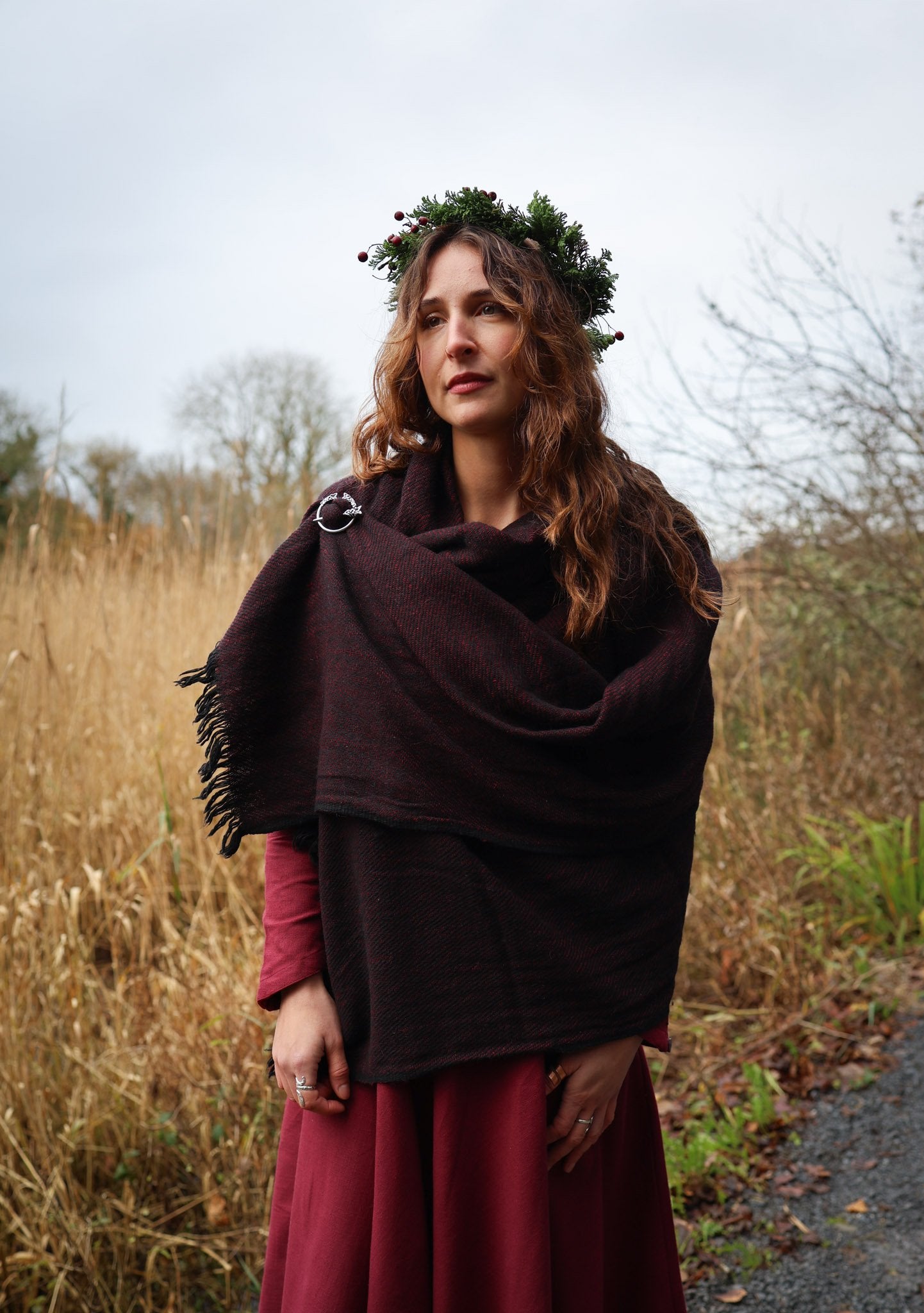 Irish-inspired maroon and black woven shawl with silver Trinity brooch for everyday folklore wear