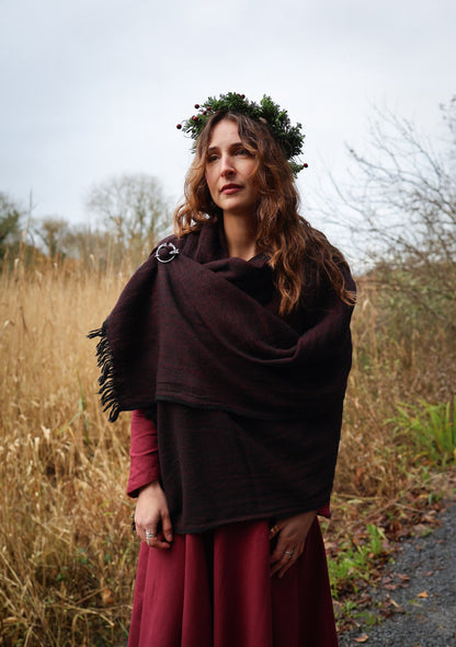 Irish-inspired maroon and black woven shawl with silver Trinity brooch for everyday folklore wear