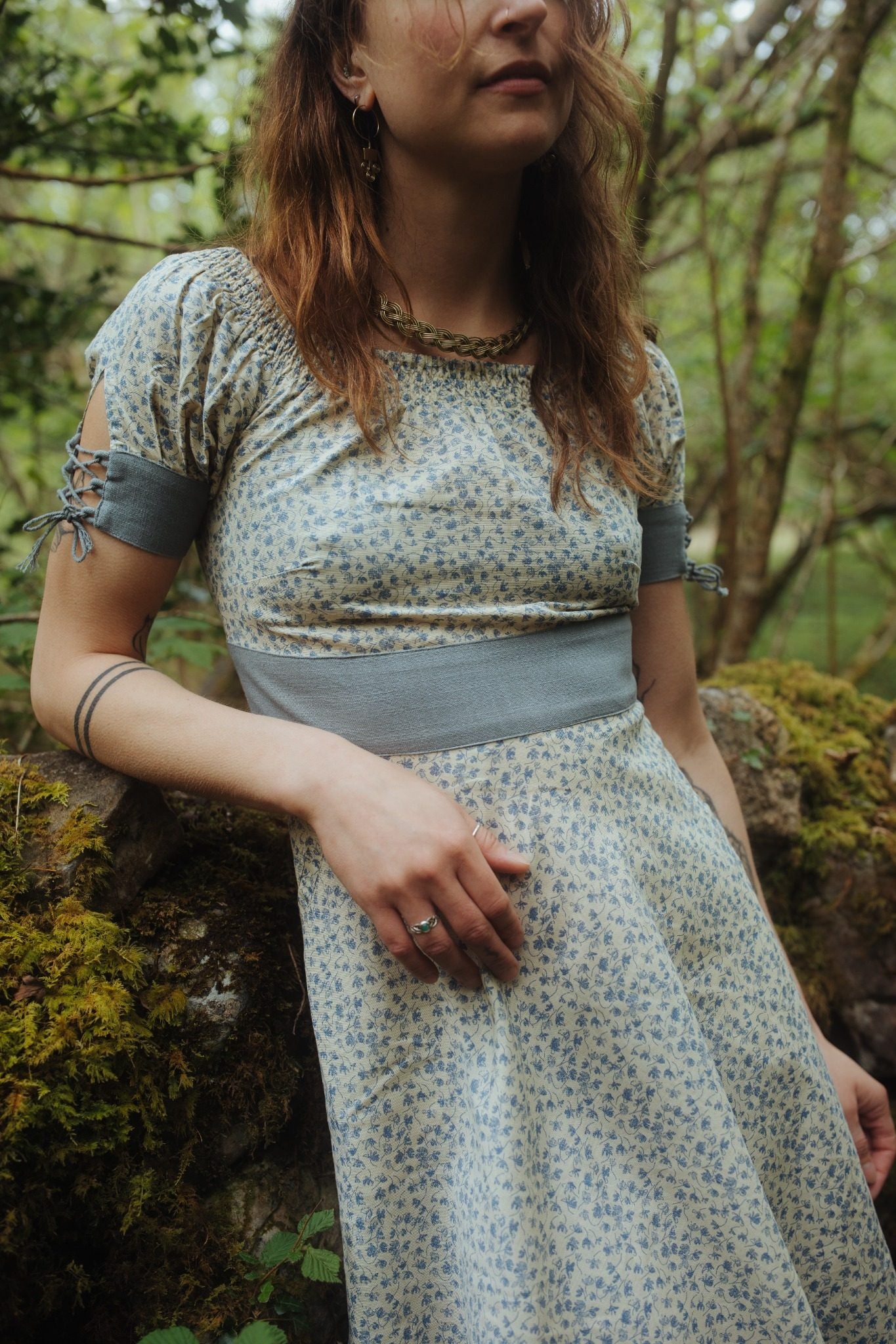 Forget Me Not Linen Dress with a blue floral linen print with lace-up back corset dress detail and soft garden party styling.