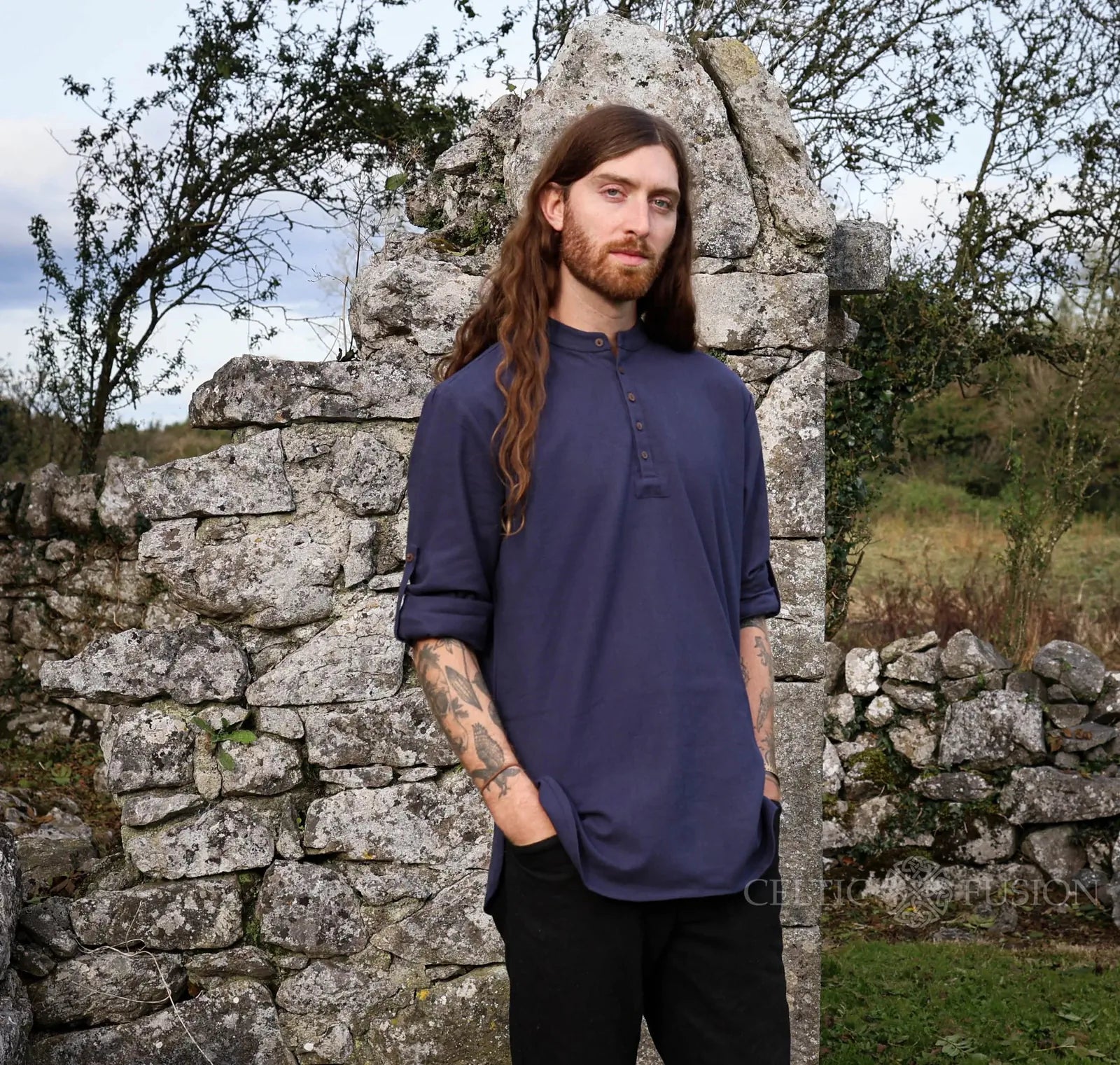 Men’s navy folk shirt with stand collar, quater button detail and long sleeves for everyday Celtic style