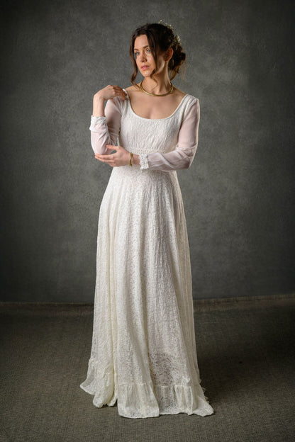Annagh ivory cotton lace Regency wedding dress with scoop neckline, sheer bishop sleeves and flowing regency-inspired skirt
