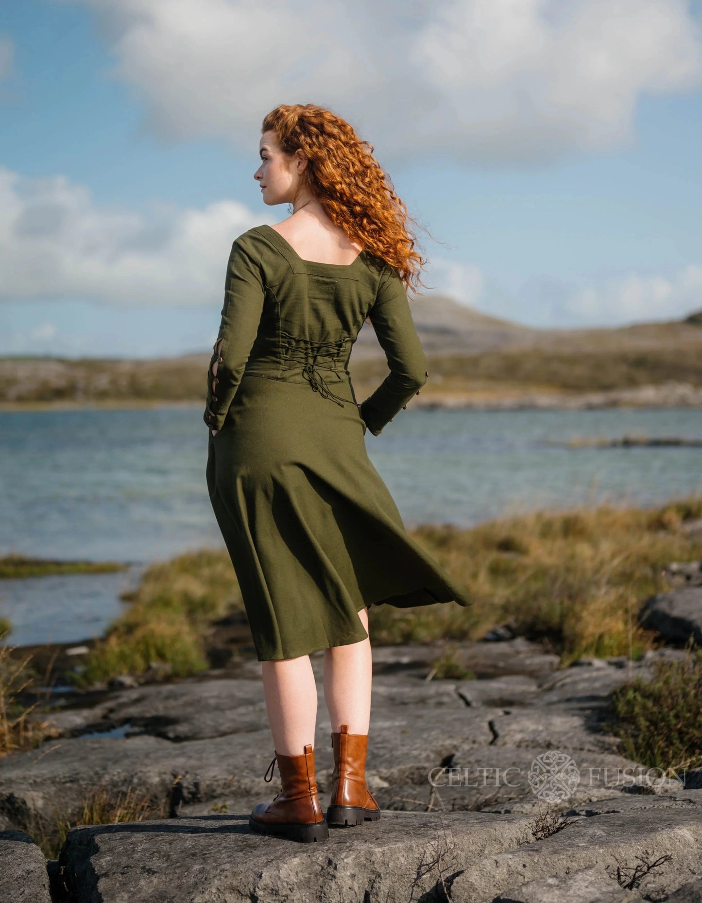 Imbas Corset Dress back view, romantic lace up back midi dress in dark green with a flowing skirt