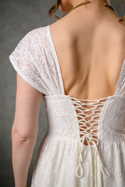 Lace-up back detail of Wild Rose corset wedding dress in ivory floral cotton lace